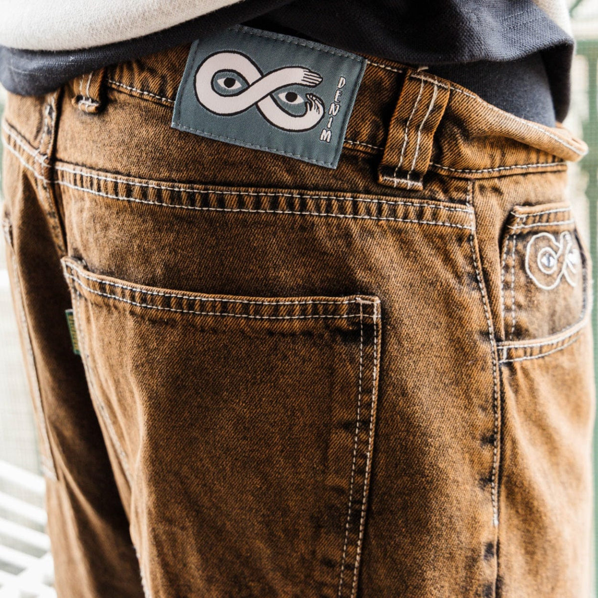 Magenta Skateboards OG Denim Jeans in bronze color, showing the relaxed fit and classic denim texture.