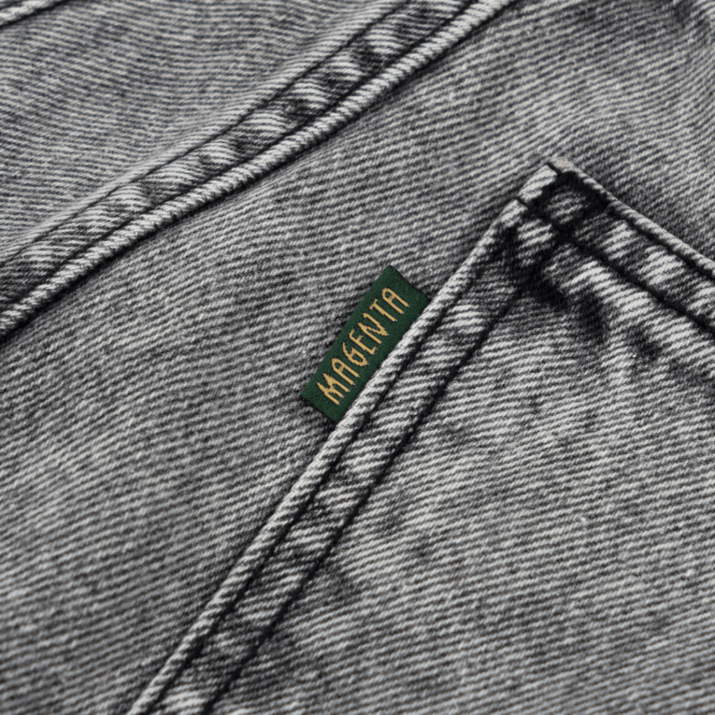 Magenta Skateboards OG Denim Stitch Jeans in acid wash showing the fit and detailed stitching on the casual denim pants.