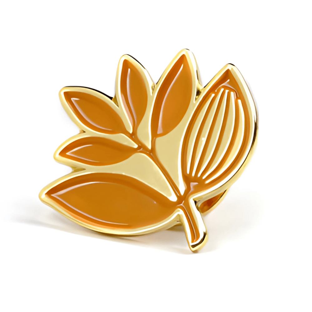Magenta Skateboards Plant enamel pin badge in burnt orange, featuring a detailed plant design on a metal pin backing.