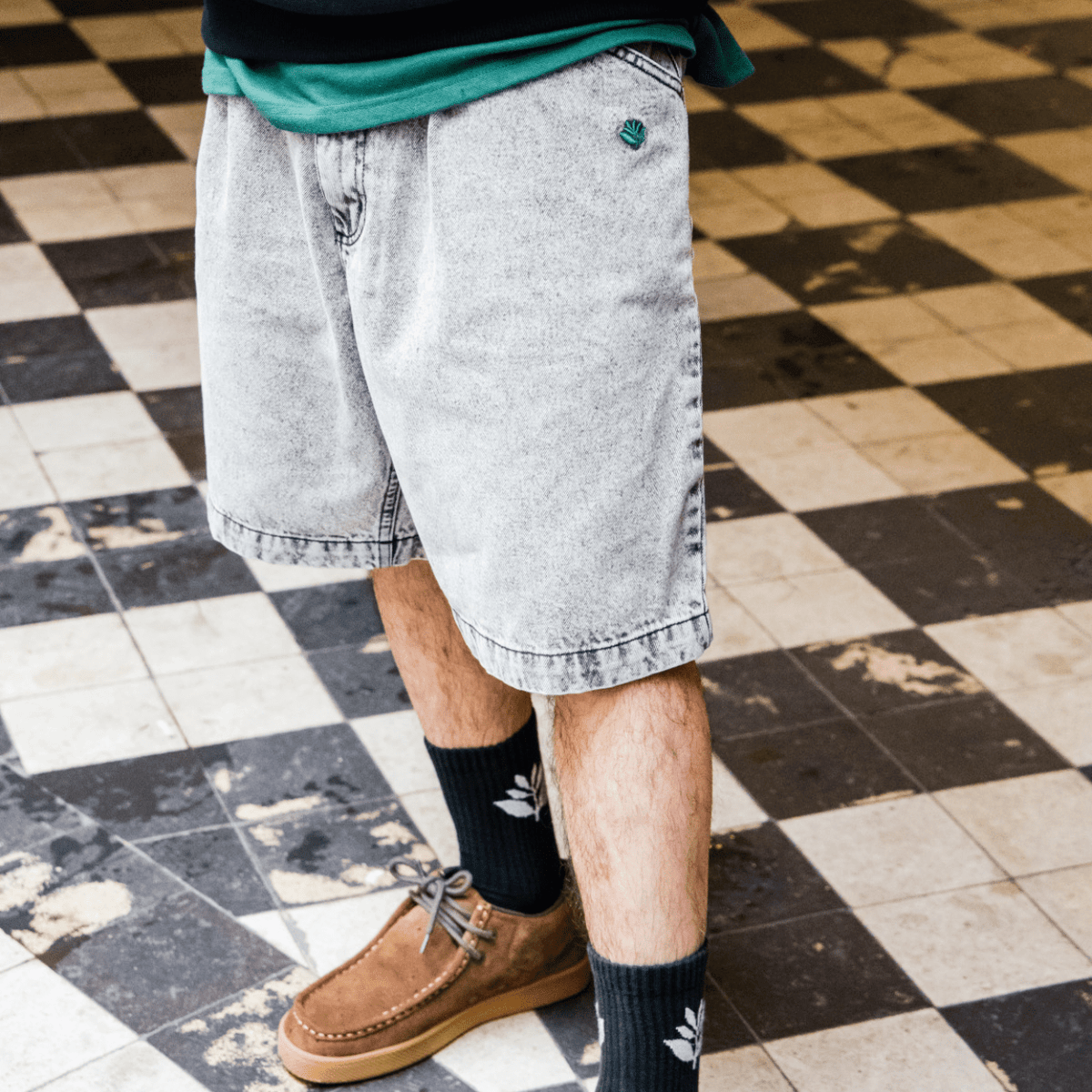 Magenta Skateboards OG Denim Long Shorts in acid wash, featuring a relaxed fit and classic denim styling for casual skatewear.
