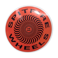 Collection of colorful skateboard stickers and slaps from The Vines skateboarding brand displayed on a surface.