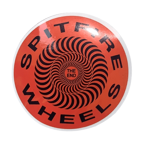 Collection of colorful skateboard stickers and slaps from The Vines skateboarding brand displayed on a surface.