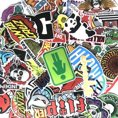 Set of vibrant skateboard stickers featuring The Vines skate brand designs on a skateboard deck.
