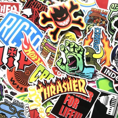 Assorted skateboard stickers featuring The Vines skateboarding brand, vibrant designs on a sheet for decorating skateboards and gear.