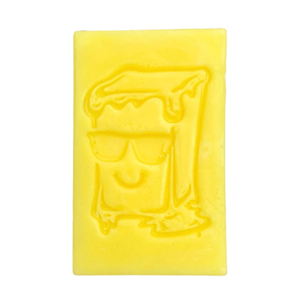 Assorted Sketti Butta OG Skateboard Wax in colorful blocks, designed to improve grip and performance on skateboards.