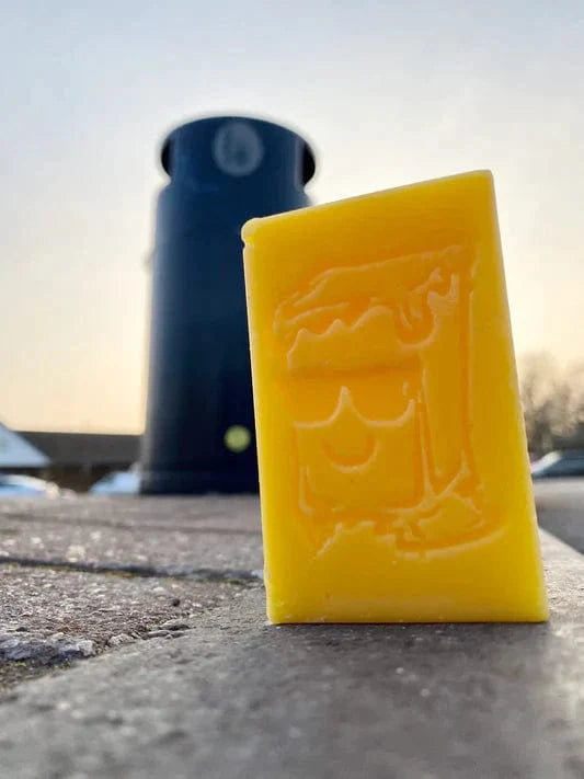Assorted Sketti Butta OG Skateboard Wax in colorful containers, designed for improving grip and performance on skateboards.
