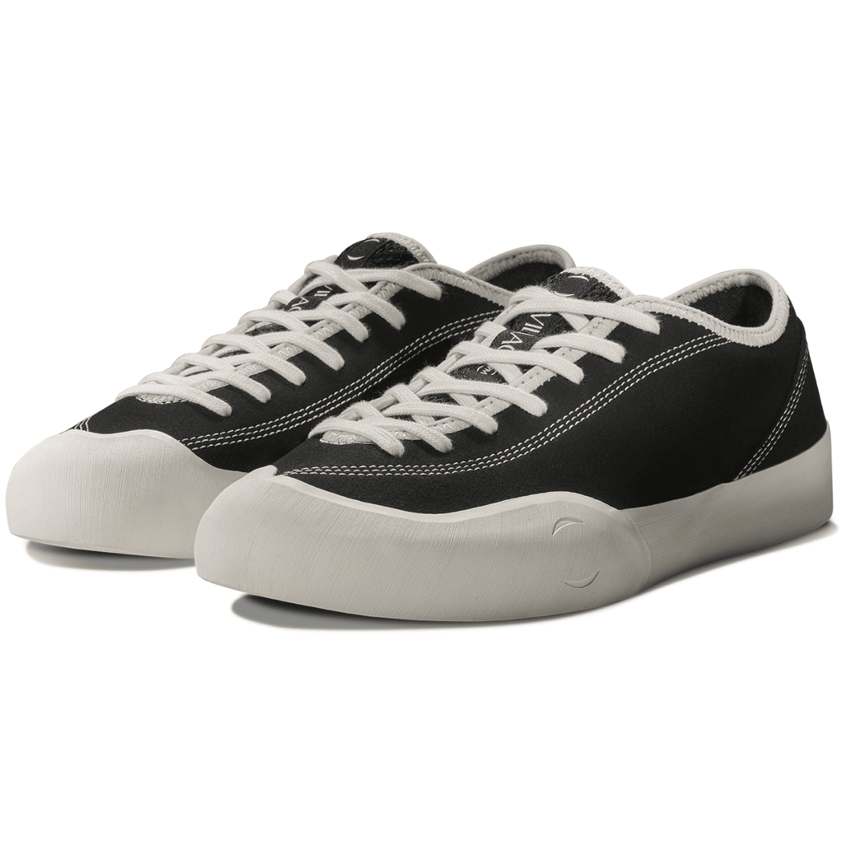 Village PM 1:30 PM skate shoes in black and white, canvas sneakers with stylish design and skateboarding grip soles.