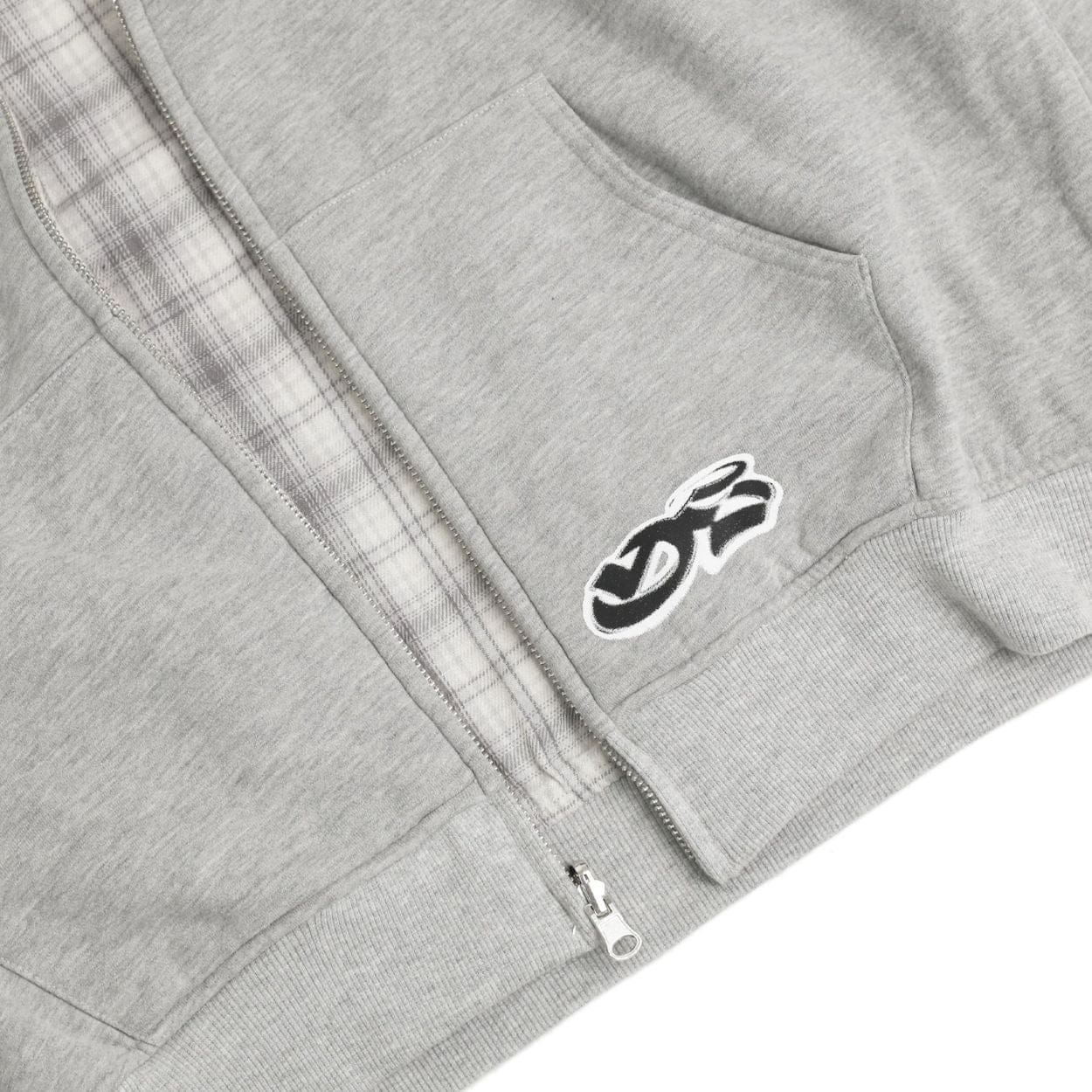 Yardsale reversible hoodie in grey and stone, showing front view with the hoodie worn casually, highlighting its color and fabric.